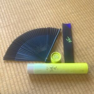 Lovely black silk fan. Includes protective sleeve and tube.